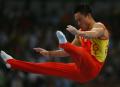 图文-体操男团中国夺得冠军 杨威双杠上挥洒自如
