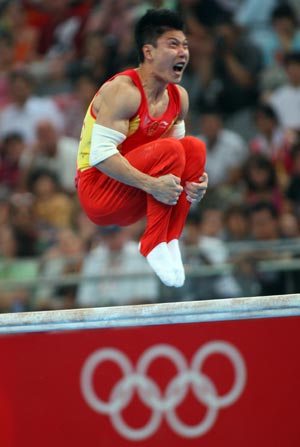 Li Xiaopeng of China wins parallel bars gold medal