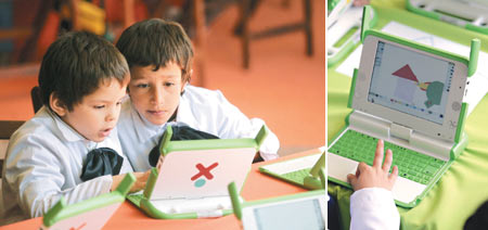 Tu Wei Wu La Gui Yi Suo Gong Li Xiao Xue De 2 Ming Yi Nian Ji Xue Sheng Zheng Zai Ju Jing Hui Shen De Kan Zhe Dian Nao Bing Mu The graph is Uruguay student of 2 of a public elementary school one grade is looking sedulously write computer screen