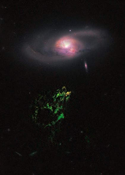 ŹռԶͼУһŹɫƺƯһϵ屻Ϊ塱һ30꣬ΧϵIC 2497ľ޴󻷴һ֡[ȨNASA, ESA, W. Keel (University of Alabama), and the Galaxy Zoo Team]