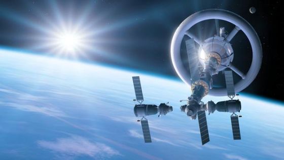 艺术概念图，展示了可产生人造重力的航天器，外形好似巨大的旋转轮