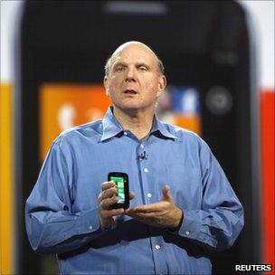 Microsoft CEO Steve Ballmer holds a Windows 7
