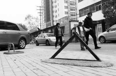 北京通过停车管理办法:私装地锁拟罚5000元