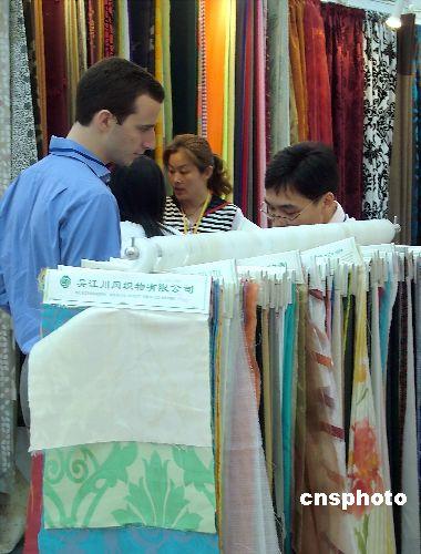 去年中国纺织品服装进出口占全国外贸总值8.9