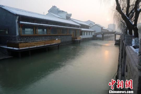 冰雪奇缘 新市古镇官方供图 浙江古镇现冰雪奇观 冰封市河引人留念