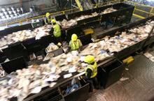Employees sort recyclables at the single-stream Waste Management/Recycle America plant in Denver. The system is similar to one Boulder County will install next year. Critics say it increases contamination, meaning more materials are thrown out, but supporters say the overall boost in participation more than compensates for a higher percentage of waste.