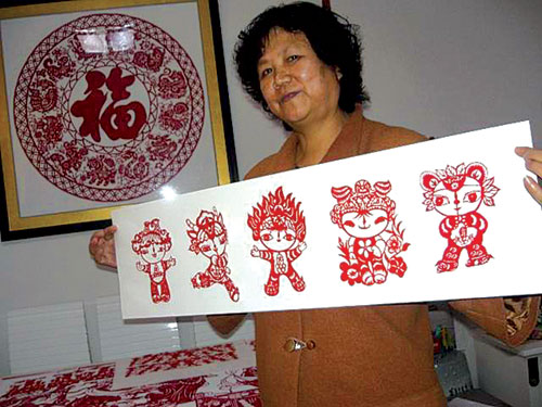 厦门民革党员创作剪纸“福娃”