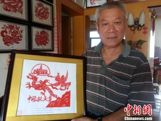 浙江七旬老人两年剪纸中国航天梦(图)