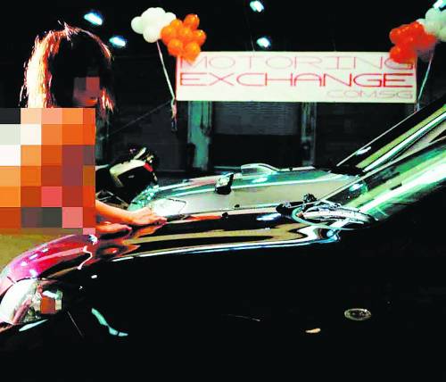 新加坡中国女留学生参与无上装洗车被开除(图