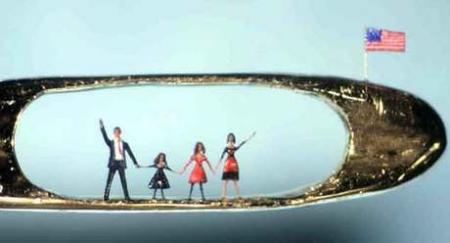 First family: A micro-sculpture of the Obamas, carved into the eye of a 24-carat gold needle by British artist Willard Wigan