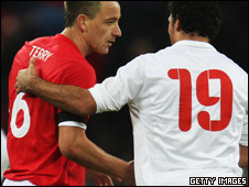 England player John Terry shaking hands with Amr Zaki of Egypt