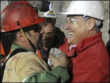 Mario Sepulveda embraces President Sebastian Pinera
