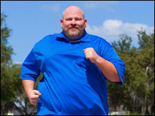 An obese man running