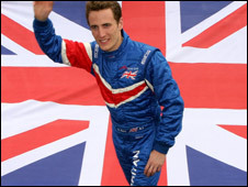 Robbie Kerr at Brands Hatch with a British flag behind him