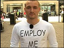 Joe Busby wearing a T-shirt with his CV on it