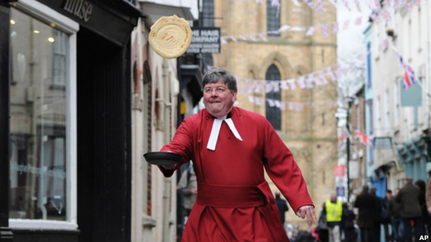 The Very Reverend Keith Jukes takes part in the annual Pancake Day Races along Kirkgate, Ripon.