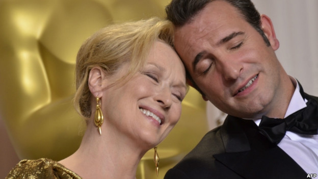 Meryl Streep and Jean Dujardin touching foreheads during the Academy Awards on 26 February.