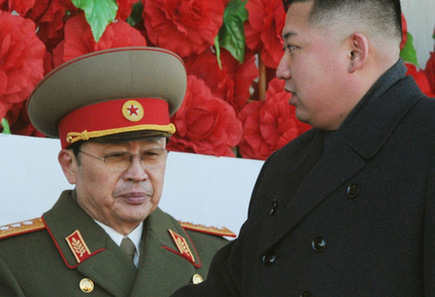 DPRK leader Kim Jong-un (R) walks past his uncle North Korean politician Jang Song-thaek, during a military parade to mark the birth anniversary of the late leader, Kim Jong-il in Pyongyang, in this file photo taken by Kyodo February 16, 2012. [Photo/Agencies] 
