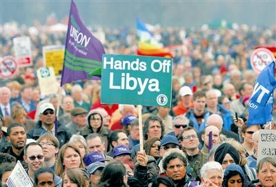 3 26, in the British capital London, protesters played against interference Libya slogan.