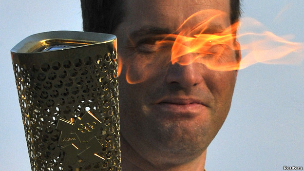 British Olympic sailor Ben Ainslee carries the Olympic torch