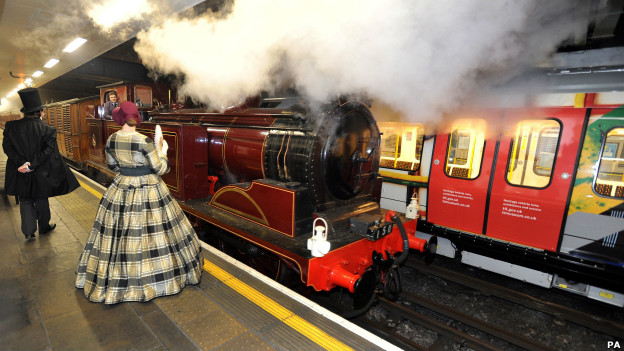A steam train pulls into Moorgate station.