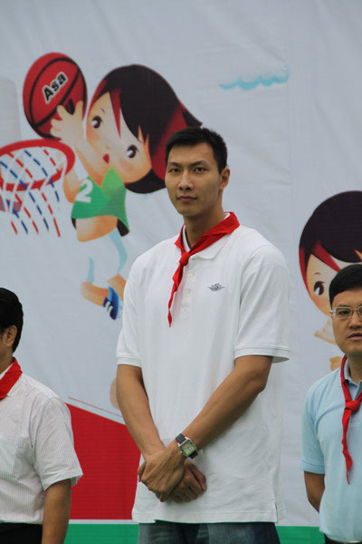 Yi Jianlian stands during dedication ceremony at sports facility, Xuanhan County, Sichuan
