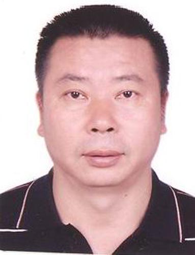 图文-北京奥运会中国代表团成立 摔跤队教练许奎元